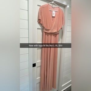 Boutique Maternity dress-NWT. Size Medium but fits like a L or XL. Extra long